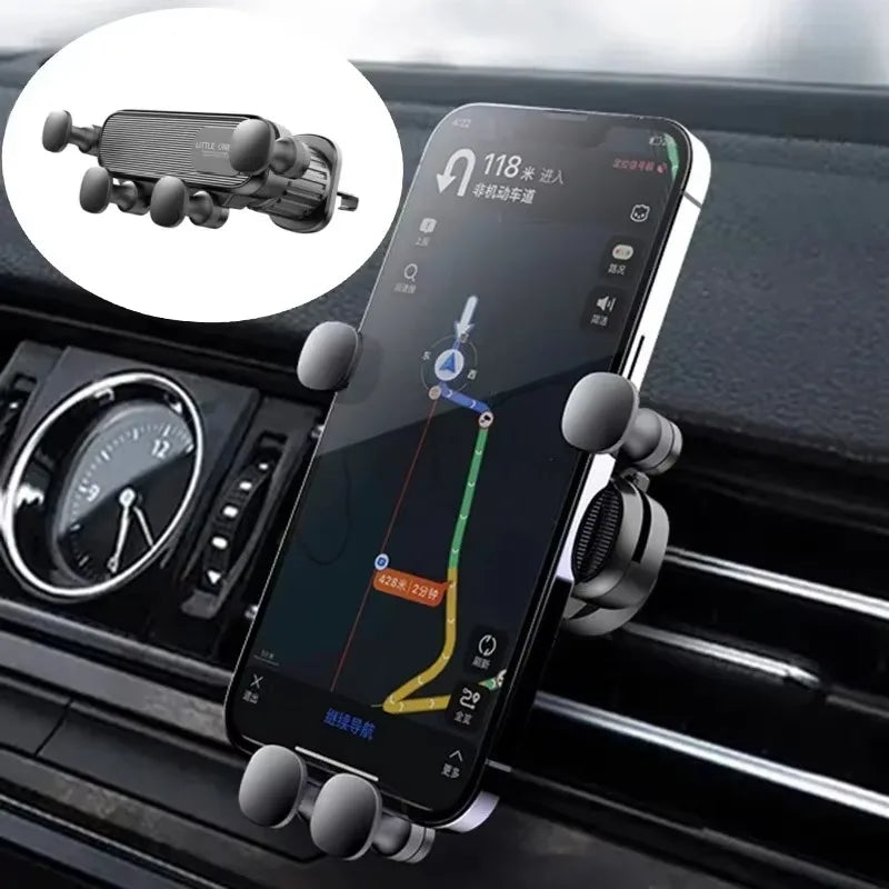 Phone mounted on a car holder with GPS app on screen, placed in a car's air vent.