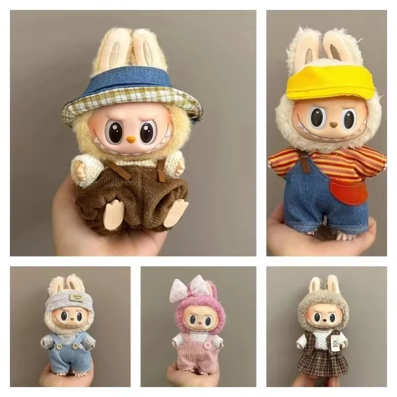 Collection of small animal figurines in various outfits on a neutral background